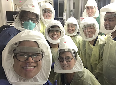 Osler residents, wearing appropriate PPE, gather for a team photo.